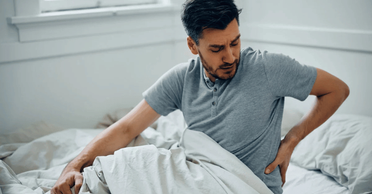 Diagram of spinal alignment while sleeping on a firm mattress