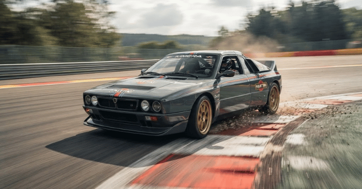 Side profile of a rally-inspired coupe on a mountain road